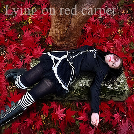 Lying on red carpet